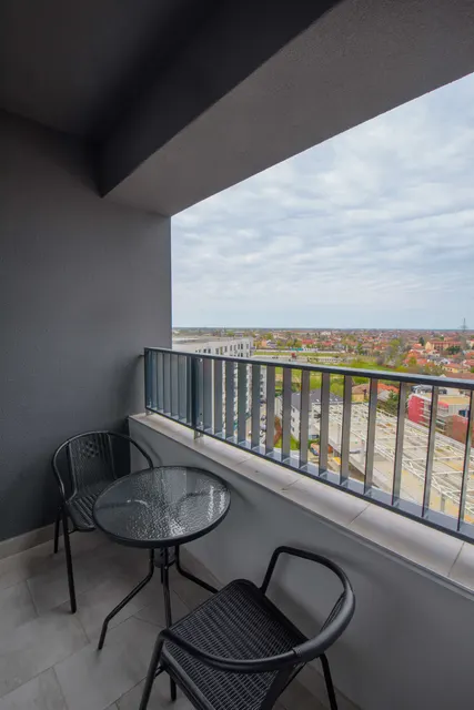 Balcony with a table for two and a view over Timișoara, at City of Mara, Timișoara