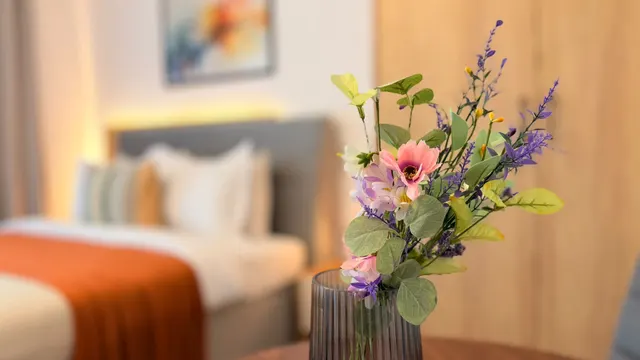 Vase of wildflowers beside the bed, at Icon Studio, București